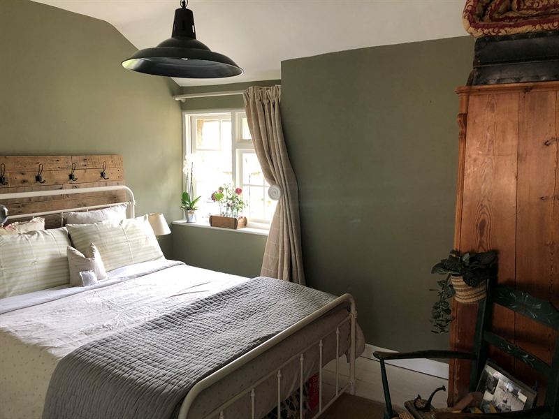 Bedroom painted in sage green
